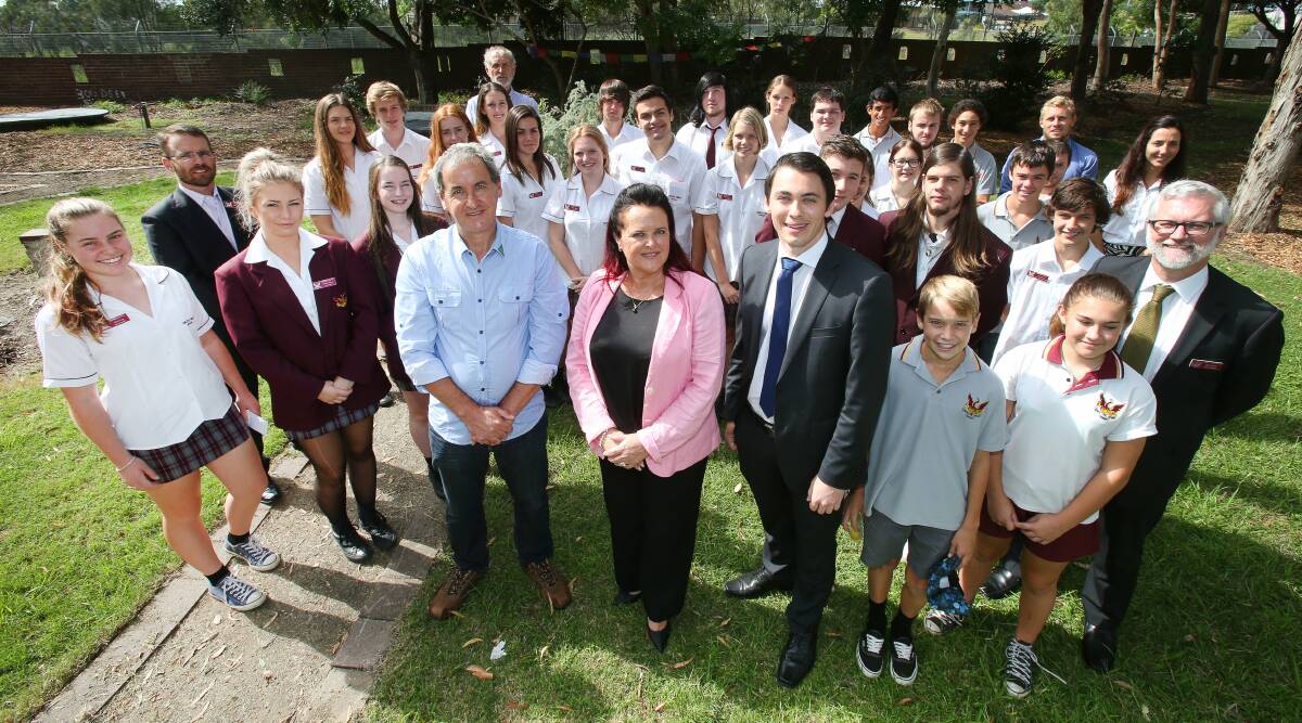 Future voters: Shellharbour candidates Peter Moran (Greens), Anna Watson (Labor) and Mark Jones (Liberal) with Dapto High School students and teachers. Picture: KIRK GILMOUR