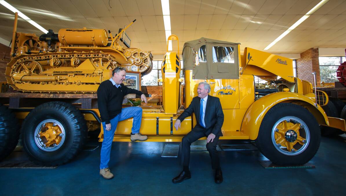 Four decades: Bob Elvy, right, with Brett Cleary at the Cleary Bros historical equipment museum. Picture: ADAM McLEAN