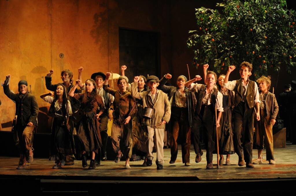 Ben, centre, with the Children’s Choir in Opera Australia’s production of Carmen. Picture: BRANCO GAICA