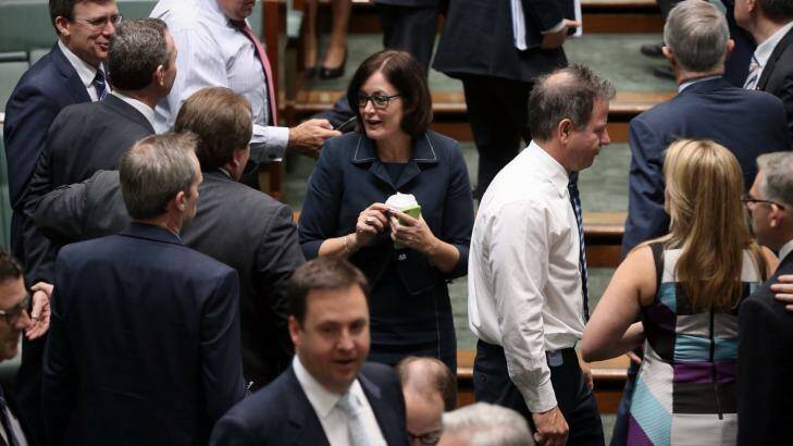 In hand: MP Sarah Henderson speaks to colleagues...with a cup of coffee in hand.  Photo: Andrew Meares