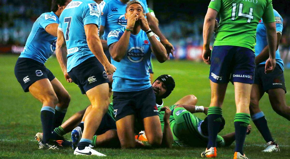 Israel Folau celebrates his try against the Highlanders at Allianz Stadium. Picture: GETTY IMAGES