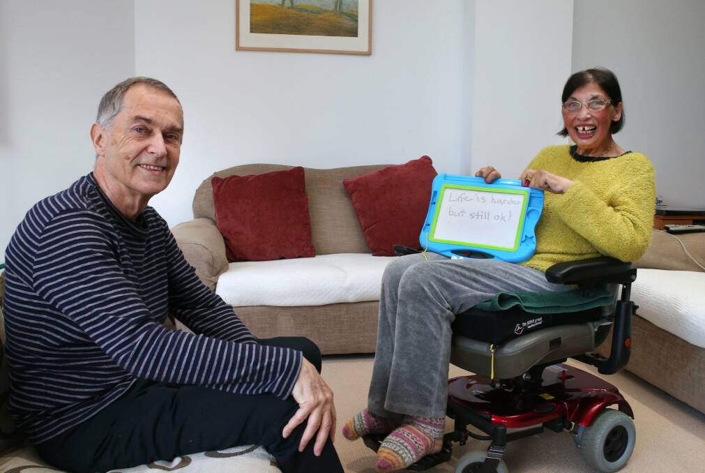 Mike and Carline Welfare use a magnetic board to communicate. Picture: KIRK GILMOUR