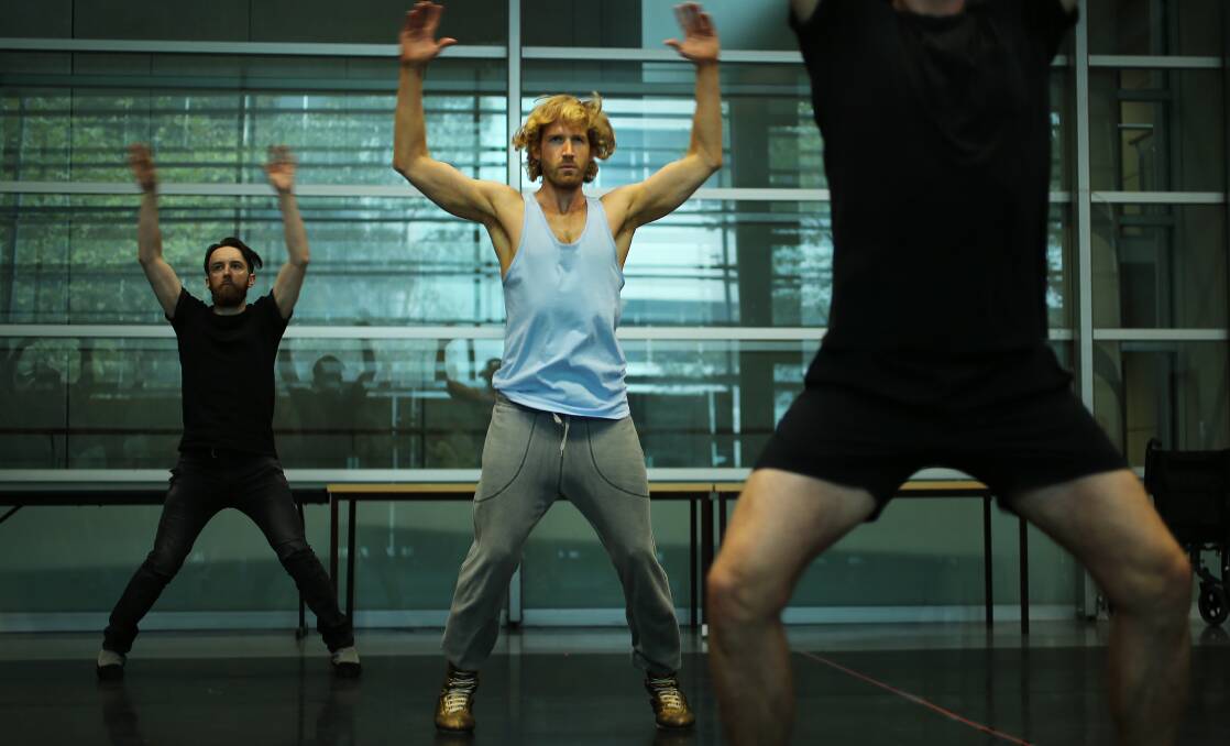 Rocking it: Brendan Irving, centre, who will be playing Rocky in Richard O'Brien's The Rocky Horror Show, during a warm-up session in Ultimo, Sydney. Picture: KATE GERAGHTY