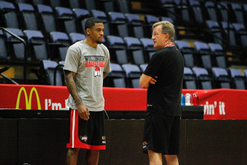 Hawks coach Geordie McLeod talking to Gary Ervin during training at the WEC. Picture: CHRISTOPHER CHAN