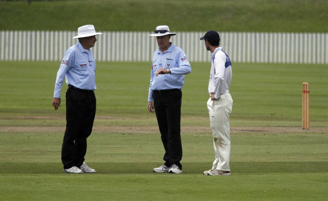 University skipper Mitch Calder talks to  the umpires  at the end of the controversial finish to the Illawarra final. Picture: ANDY ZAKELI