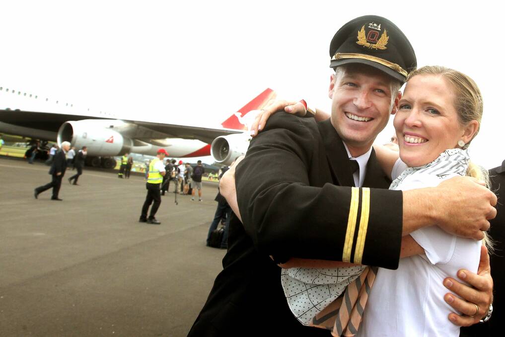 Landed: Pilot Michael East, with his wife, Michelle. Picture: SLYVIA LIBER