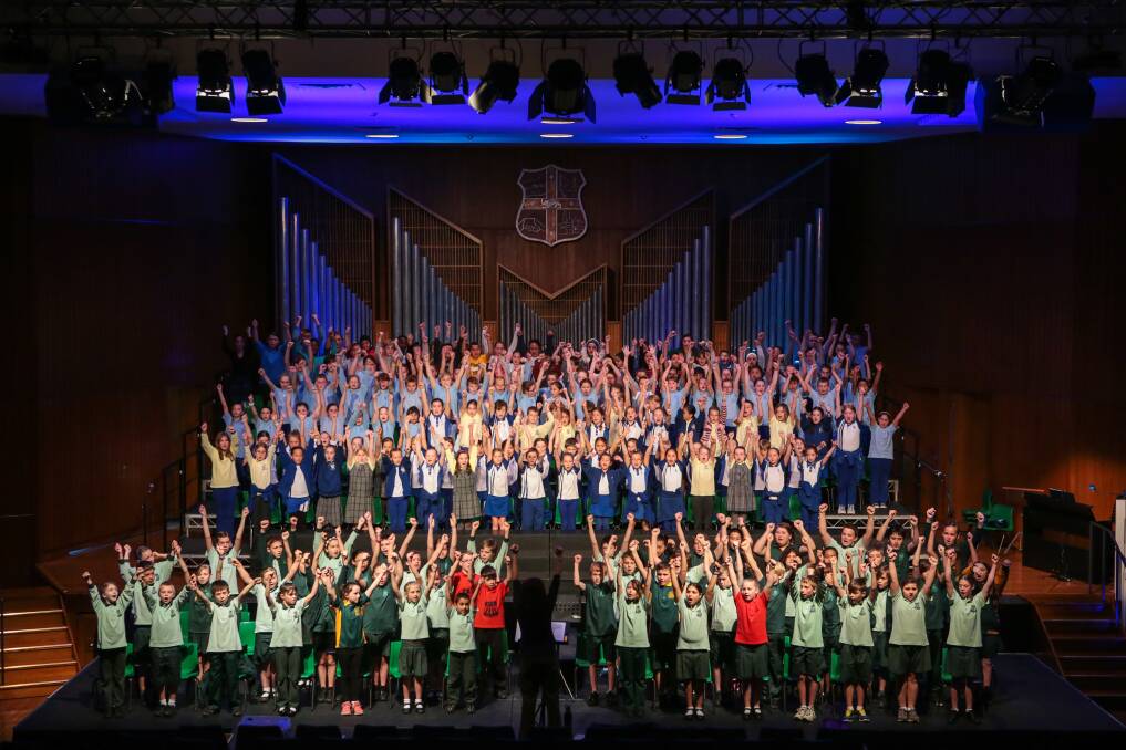 Children rehearsing on Thursday at Wollongong town hall for the Wollongong schools music festival 60th anniversary. Picture: ADAM McLEAN