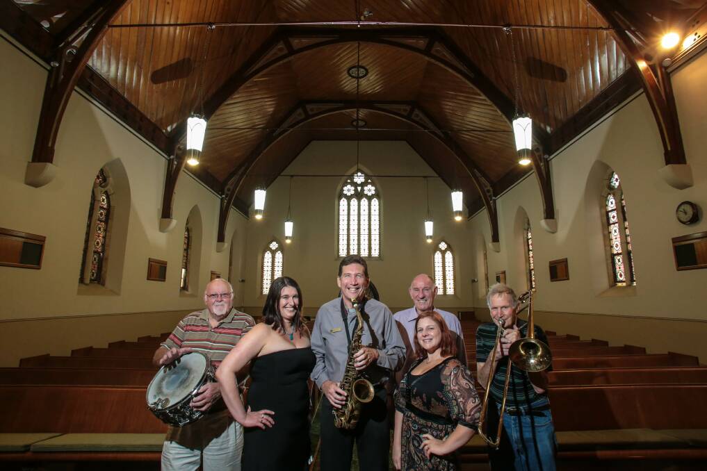 Belmore Basin Jazz Band members John Dent (left), Annaliesa Kirkwood, Bill Williamson, Gillian Meers and Wal Gregory with the Rev Geoffrey Flynn (centre) at Wesley Church on the Mall. Picture: ADAM McLEAN