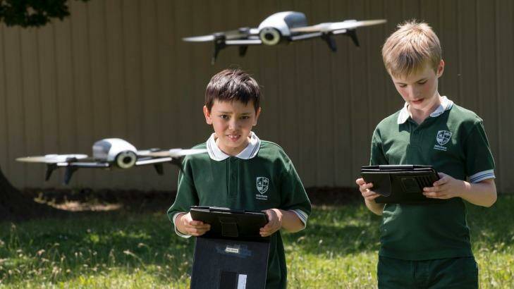 Mitcham Primary School students Jack and Aidan have been programming drones as part of the school's innovative STEM program. Photo: Eddie Jim