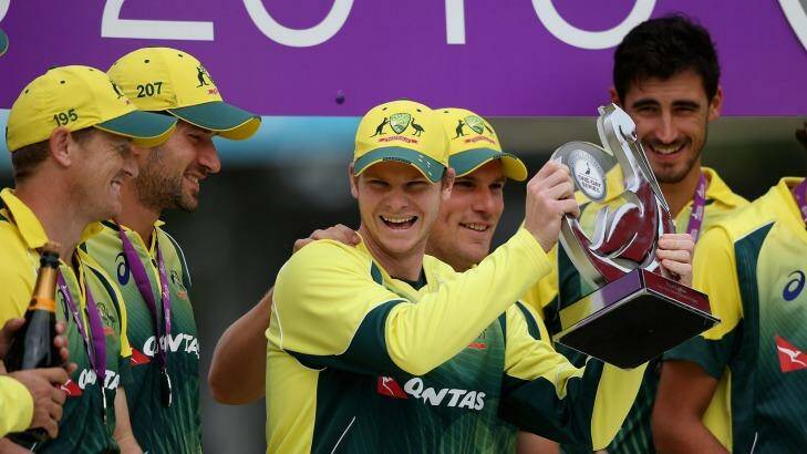 Steve Smith celebrates with his team after claiming the one-day series against England at Old Trafford on Sunday.  Photo: Laurence Griffiths