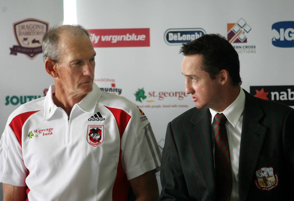 Newly-appointed Wests Tigers coach Jason Taylor (right) chats to then Dragons coach Wayne Bennett in 2009.
