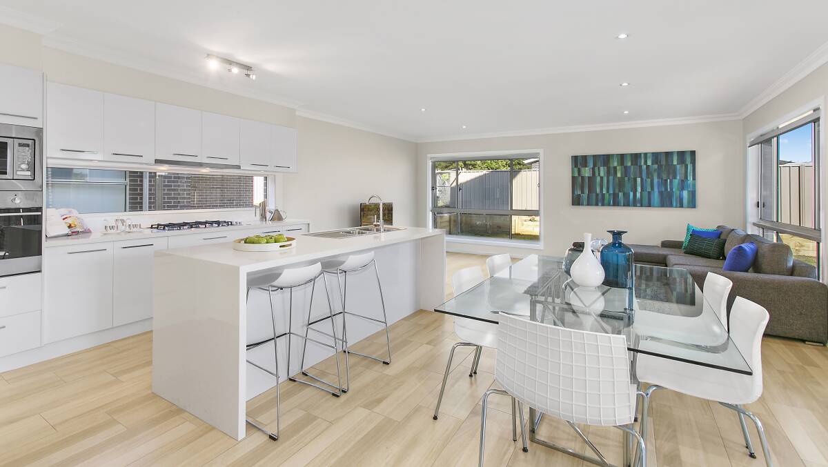 The kitchen and dining area of 4 Shallows Drive, Shell Cove, which is on the market with McGrath Estate Agents.