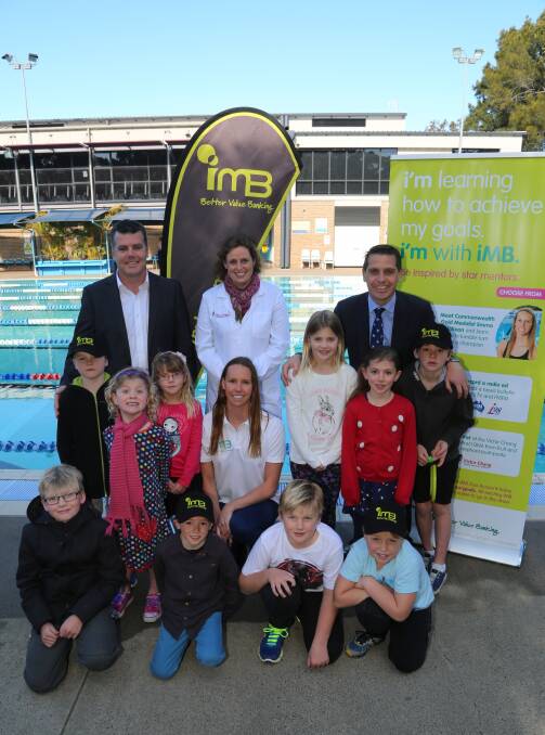 Role model: Emma McKeon (centre) with Michael Brannon, Dr Nicole Smith, Ryan Park and some young fans. Picture: GREG ELLIS