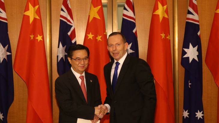 China's Commerce Minister, Gao Hucheng, with Prime Minister Tony Abbott at Parliament House on Wednesday. Photo: Andrew Meares