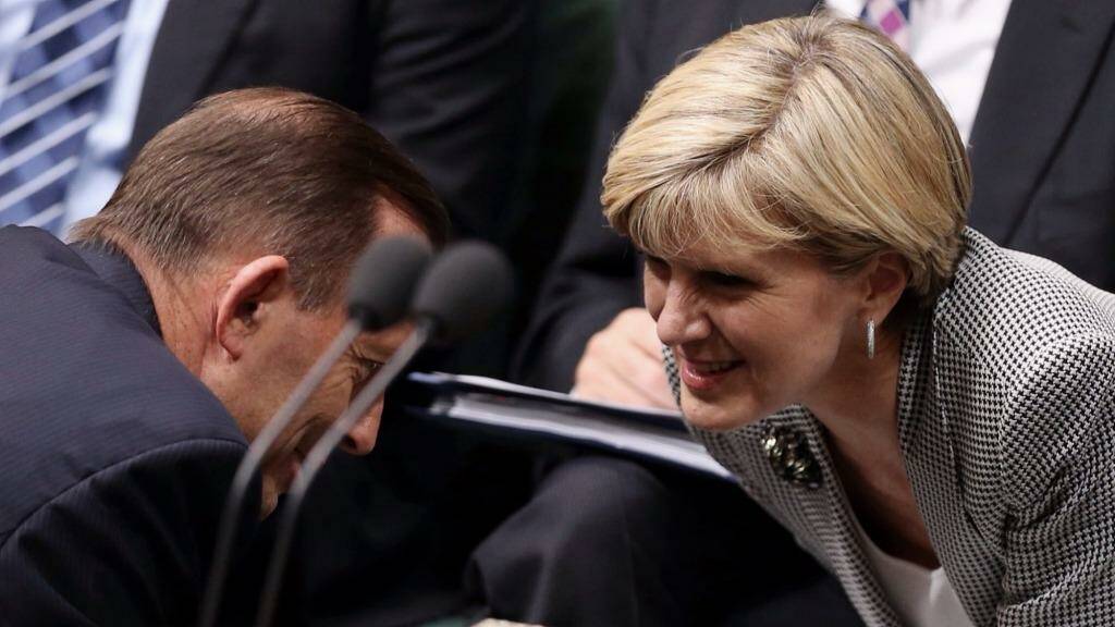 Foreign Minister Julie Bishop, talking with Prime Minister Tony Abbott, has questioned Tanya Plibersek's loyalty as Labor deputy leader.  Photo: Andrew Meares
