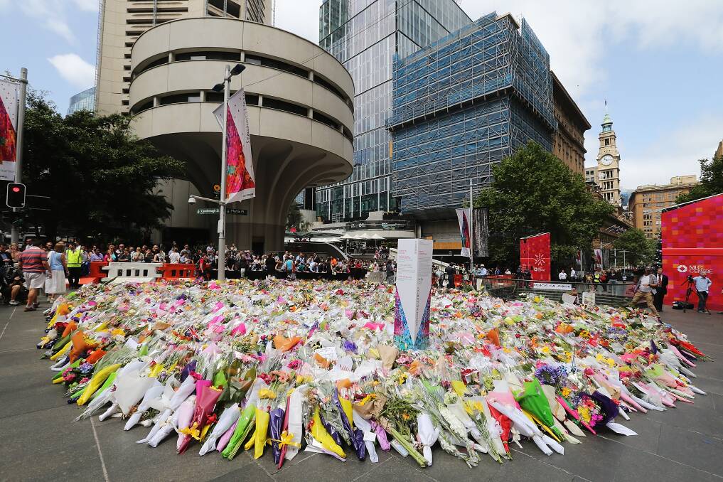 Flowers are left as a sign of respect at Martin Place. Picture: Joosep Martinson/Getty Images.