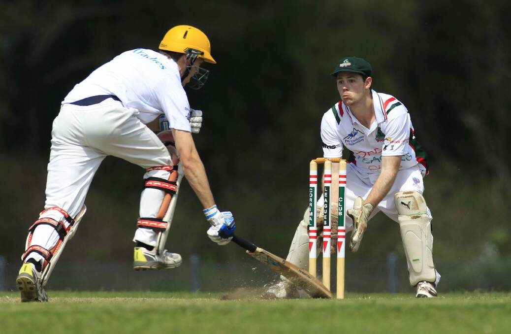 Helensburgh's Matthew Ward scampers to make his ground as Corrimal 'keeper Tom McDevitt is about to remove the bails.
