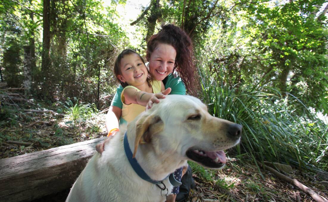 Kari Hill, Ruby Hill-Nguyen and Remy, one of the two dogs that went missing with Ruby on Saturday. Picture: ADAM McLEAN