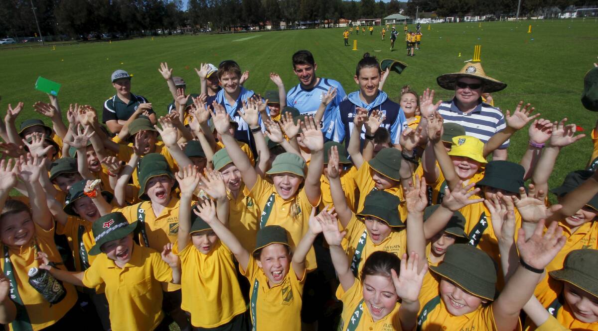 Having a blast: Oak Flats Public School students enjoy meeting Australian cricket stars Shane Watson, Moises Henriques and Nic Maddinson during the NSW Blues' Country Blitz promotion on the South Coast. Picture: ANDY ZAKELI