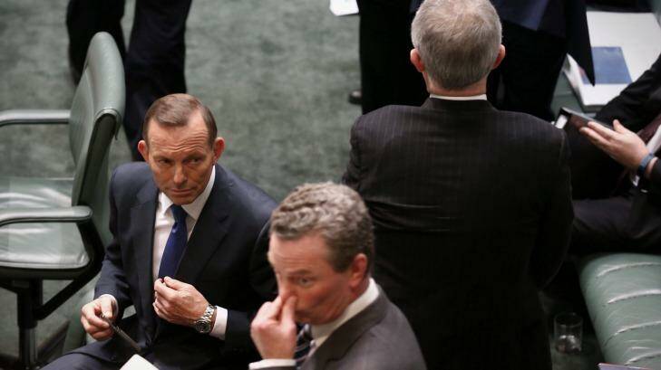 Malcolm Turnbull passes Prime Minister Tony Abbott and Christopher Pyne on Wednesday. Photo: Andrew Meares