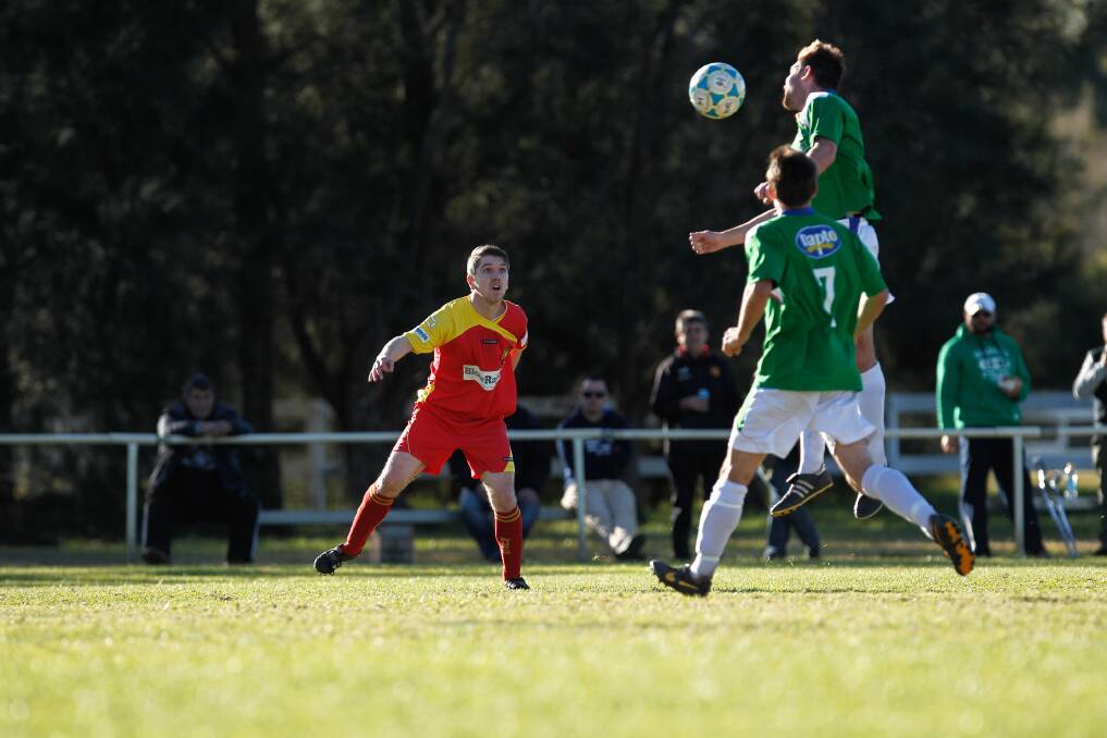 Dapto Fury (green) at work against Wollongong United in Kanahooka at the weekend. Picture: CHRISTOPHER CHAN
