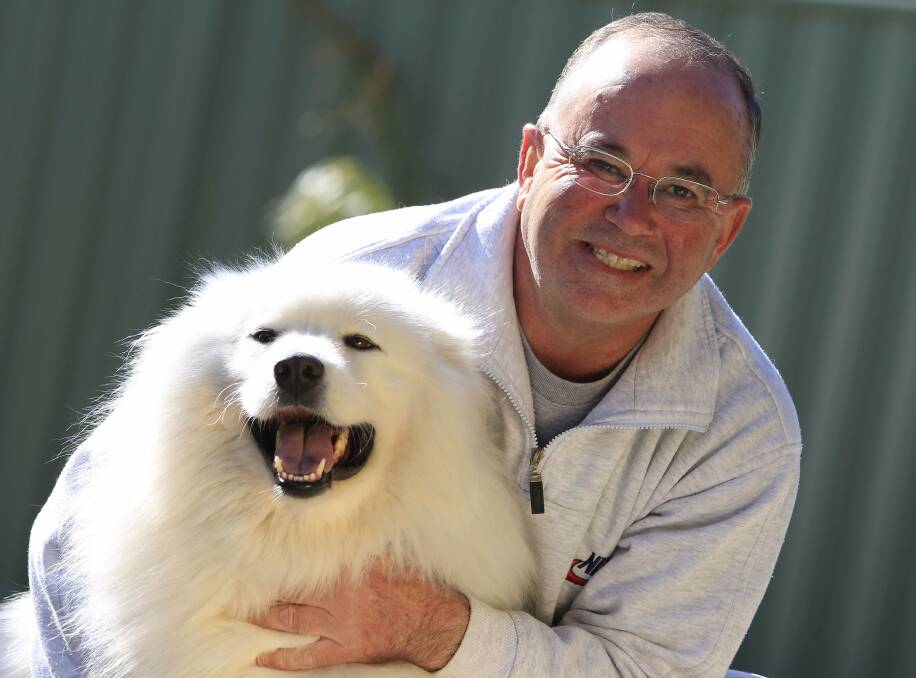 Phil Syer is vigilant about checking his dog, Prince, for paralysis ticks after the death of his first Samoyed.Picture: ANDY ZAKELI