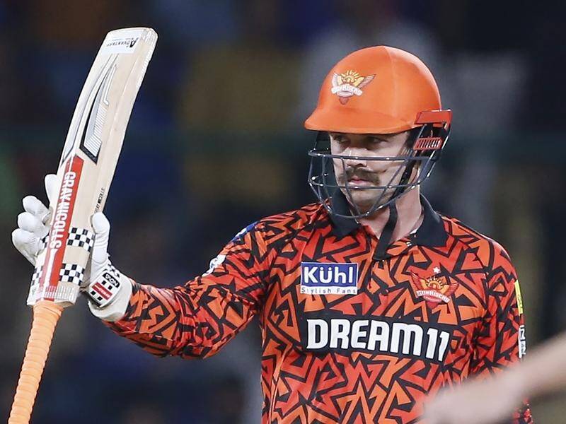 Travis Head celebrates his amazing feat of scoring 50 off just three overs in the IPL. (AP PHOTO)