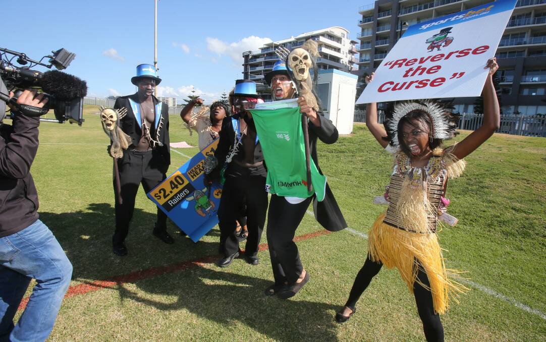 A group of witch doctors trying to "reverse the curse" at Dragons training on Friday. Picture: ROBERT PEET