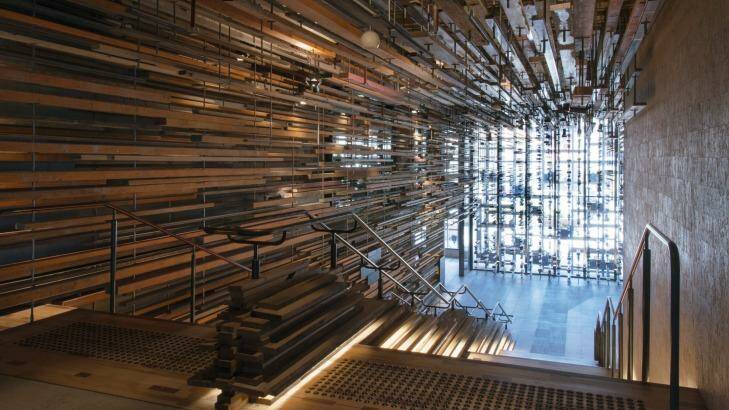 Hotel Hotel's grand staircase uses spars of recovered timber to create a dramatic feature.