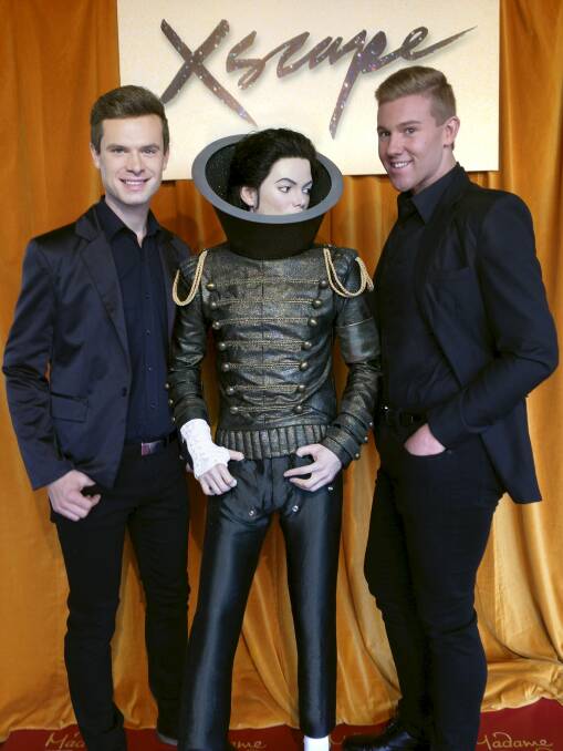 New threads for famous star: Robert Manzini (left) and Ricky Milne with the Michael Jackson wax figure, dressed in the jacket they designed and created.Picture: SONY MUSIC AUSTRALIA