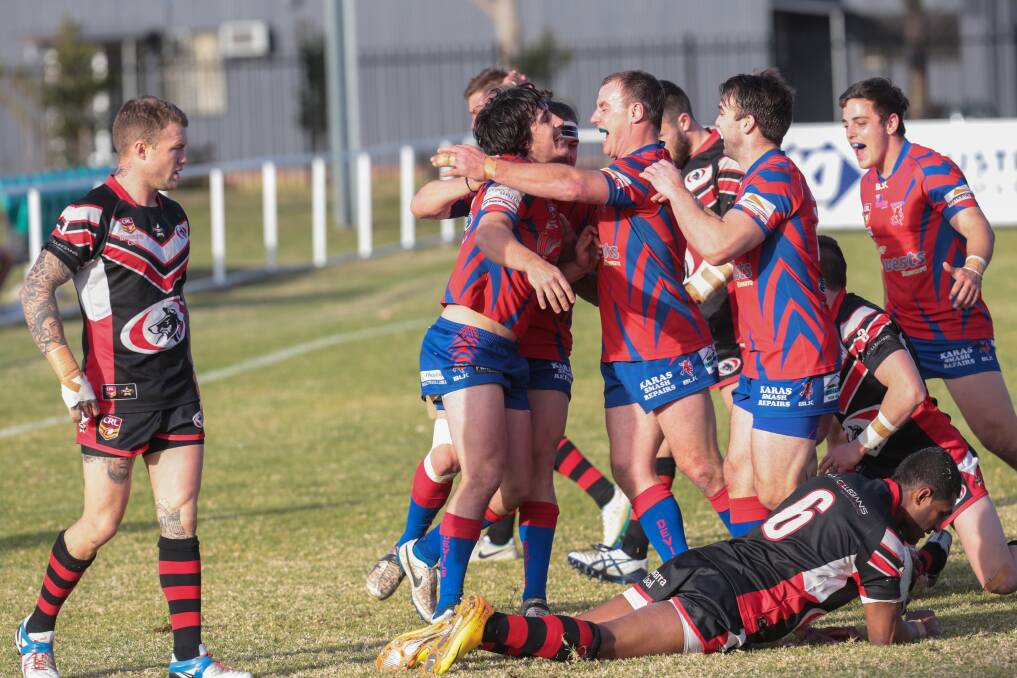 Wests players congratulate Clint Wright on scoring. Picture: ADAM McLEAN