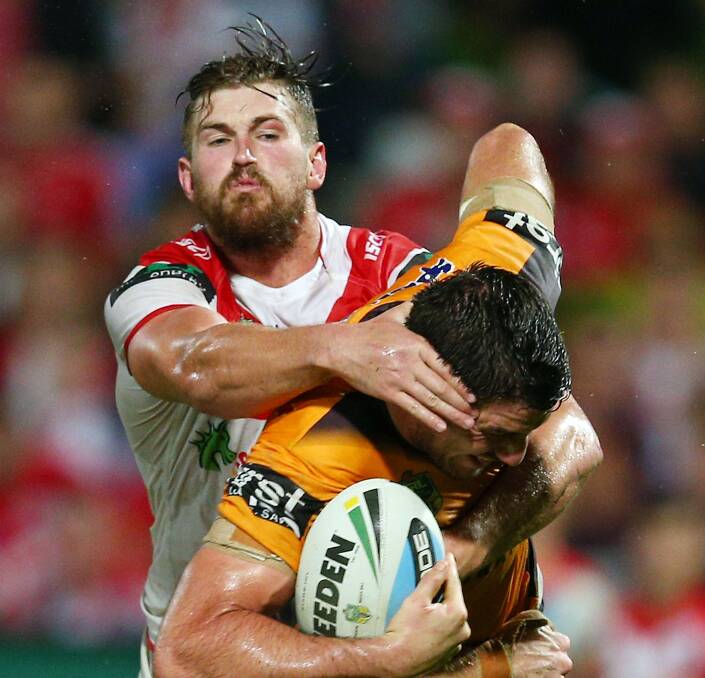 Broncos backrower Matt Gillett is tackled by Dragons second rower Will Matthews at WIN Jubilee Stadium. Picture: GETTY IMAGES