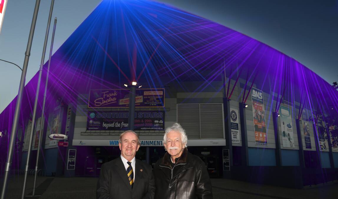 Glow: Rotary Club of Wollongong president Professor Michael Hough and Leigh Robinson feature in graphic designer Karolina Stojkovska's impression of a lit up WIN Entertainment Centre.