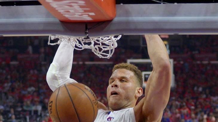 Los Angeles Clippers forward Blake Griffin (32) dunks as San Antonio Spurs guard Patty Mills, of Australia, watches during the first half of Game 7 in a first-round NBA basketball playoff series, Saturday, May 2, 2015, in Los Angeles. (AP Photo/Mark J. Terrill) Photo: Mark J. Terrill