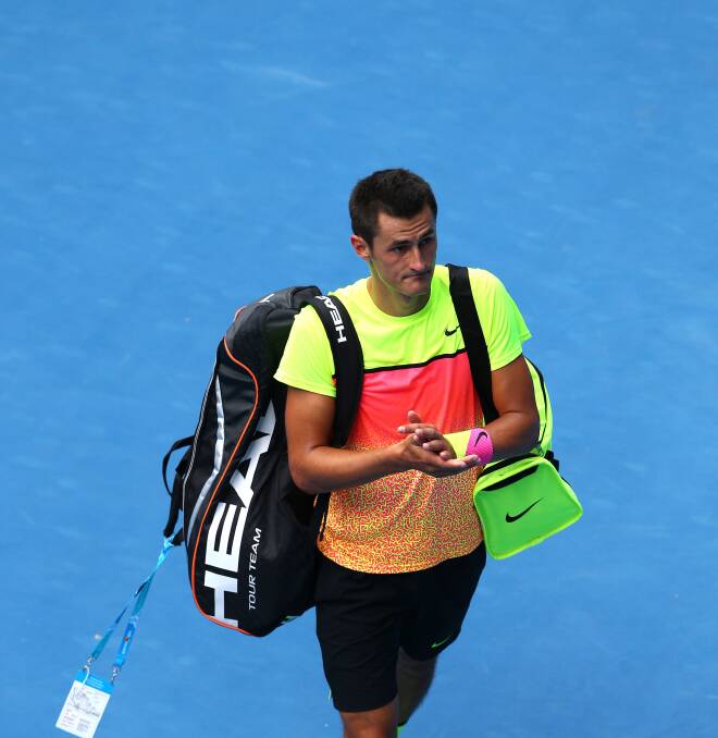 Bernard Tomic leaves the court at Melbourne Park after his loss to Tomas Berdych on Sunday. Picture: GETTY IMAGES