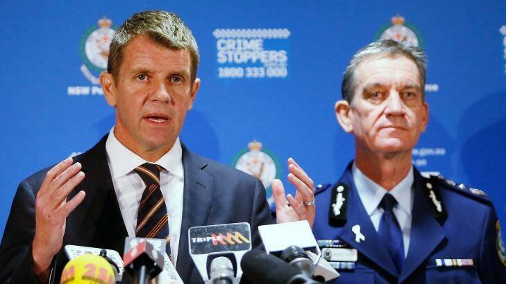 NSW Premier Mike Baird (left) speaks as NSW Police Commissioner Andrew Scipione looks on during a press conference about the siege in Martin Place, Sydney. Photo: Daniel Munoz/Getty Images