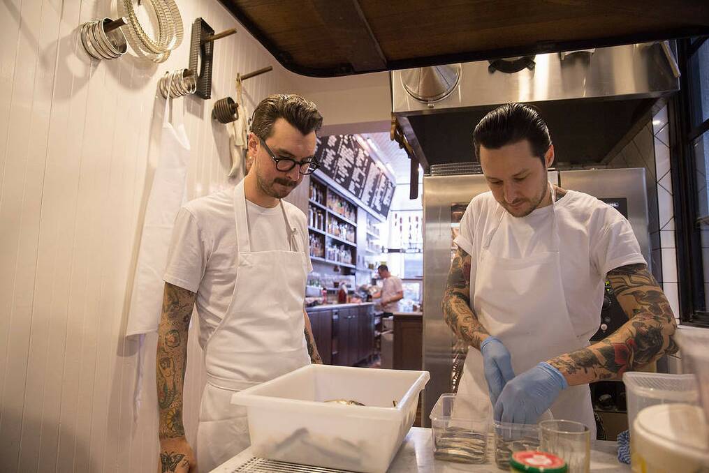 Jesse Warkentin and Elvis Abrahanowicz in the kitchen preparing sardines. Photo: Michele Mossop