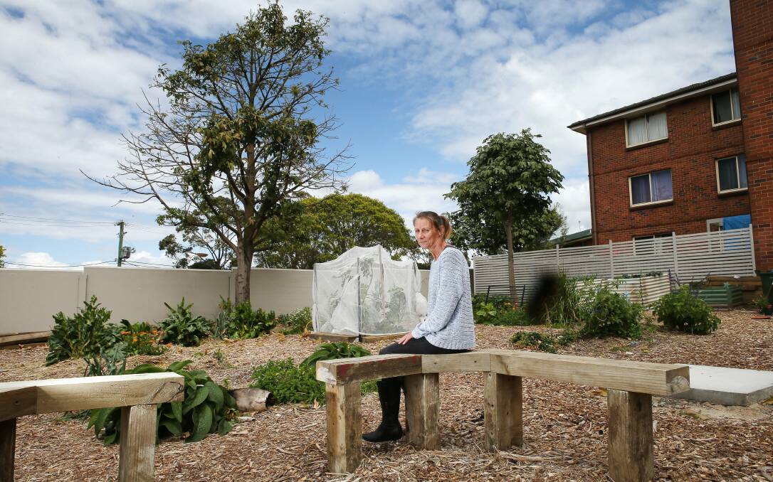 Sharyn Lacey helps out in the Todd St, Warrawong, community garden. Picture: KIRK GILMOUR