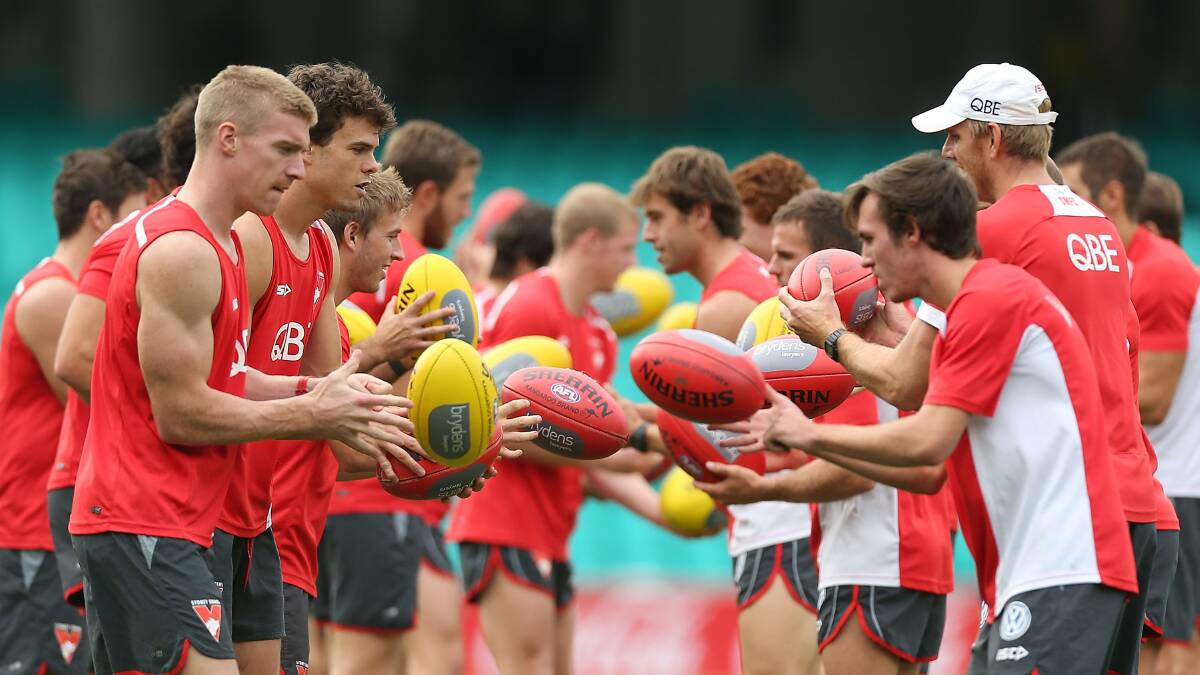 Sydney Swans' work through a hand-passing drill at SCG in preparation for their clash with Fremantle. Picture: GETTY IMAGES