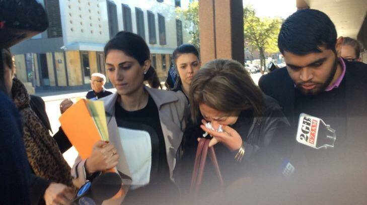 A distressed friend of Kazem Mohamadi Payam leaves court in tears. Photo: Emma Partridge