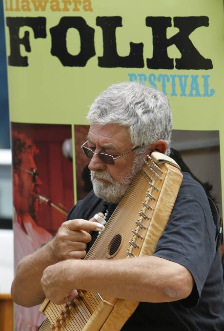 Celebrated auto harp  musician Denis McKay playing at the launch of the Illawarra Folk Festival, which is being held at Bulli Showground on January 15-18. Picture: ANDY ZAKELI
