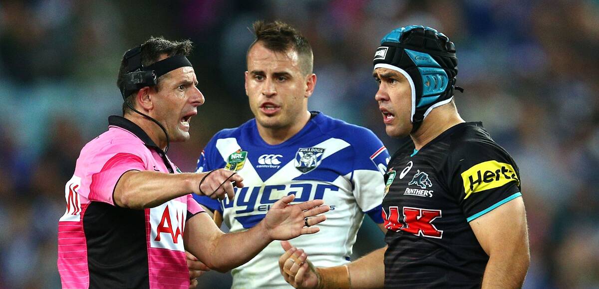 Referee Gavin Badger gets quizzed by Josh Reynolds and Jamie Soward. Picture: GETTY IMAGES