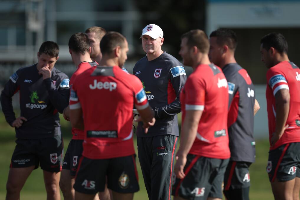 Dragons at training with coach Paul McGregor, centre, who understands the task ahead to earn premiership status. Picture: ADAM McLEAN