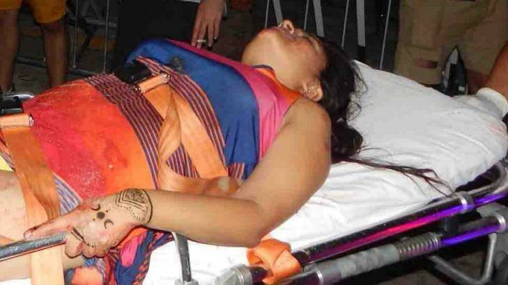 A woman is treated by paramedics after being show at the nightclub.  Photo: Por Esto de Quintana Roo/AP