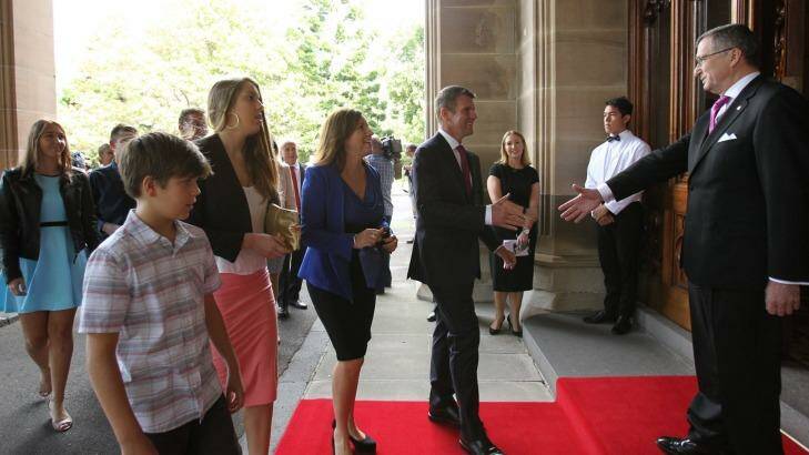 Premier Mike Baird arrives at Government House with his family. Photo: Louise Kennerley