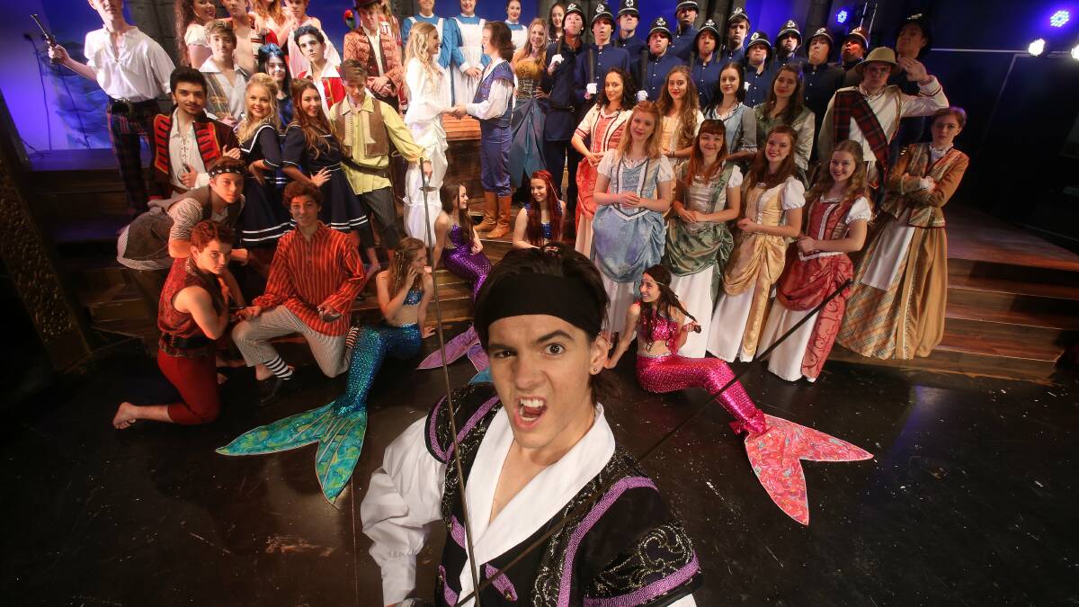Arrgh, me lads and lassies: Brayden Kennedy as the Pirate King with the cast of The Pirates of Penzance. Picture: ROBERT PEET