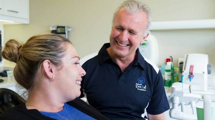 Dr David Digges with Danielle Valia, in his dental surgery. He formed a national network of 100 dentists who donate a day or two a year to provide free care to those who can't access or afford timely care. Photo: Janie Barrett