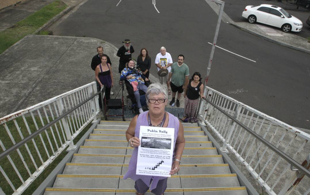 Rally organiser Sandra Luschwitz with members of the community action group fighting for lifts at Unanderra train station. A public rally will be held on Wednesday night. Picture: ANDY ZAKELI