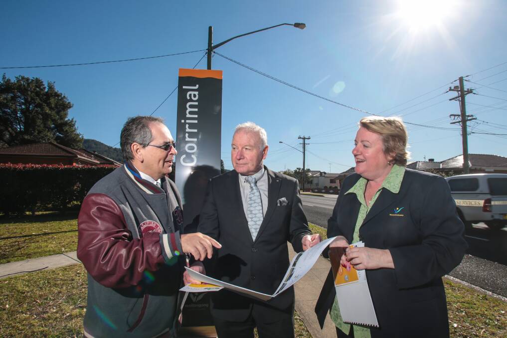 Lord Mayor Gordon Bradbery with Councillor Janice Kershaw and Corrimal Chamber of Commerce President Paul Boultwood check out the new Corrimal signs.Picture: ADAM McLEAN