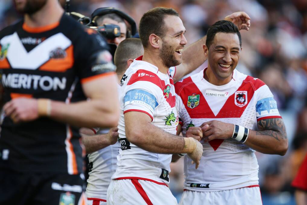Dragons fullback Jason Nightingale celebrates with Kiwi mate and league returnee Benji Marshall after scoring a try against the Tigers. Picture: GETTY IMAGES
